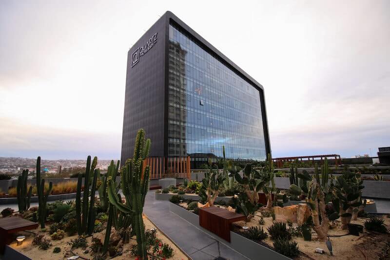 Exterior view of Quartz Hotel Tijuana showcasing its modern architecture, sleek design, and prominent location in the bustling Zona Río district.